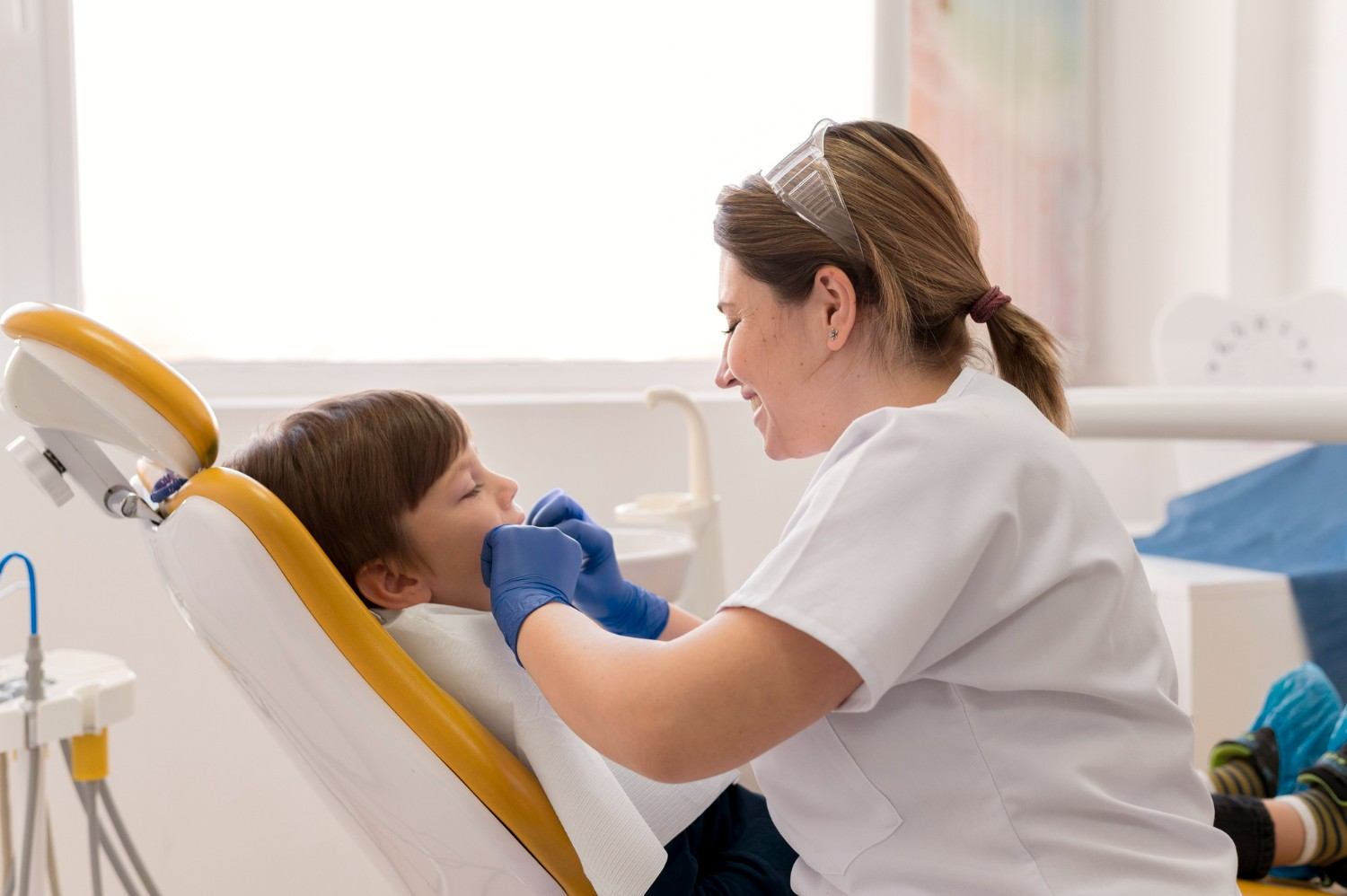 Female dentist and girl