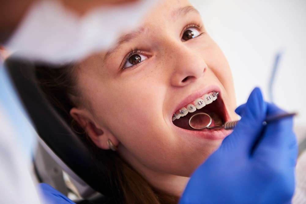 Girl with braces during a routine dental